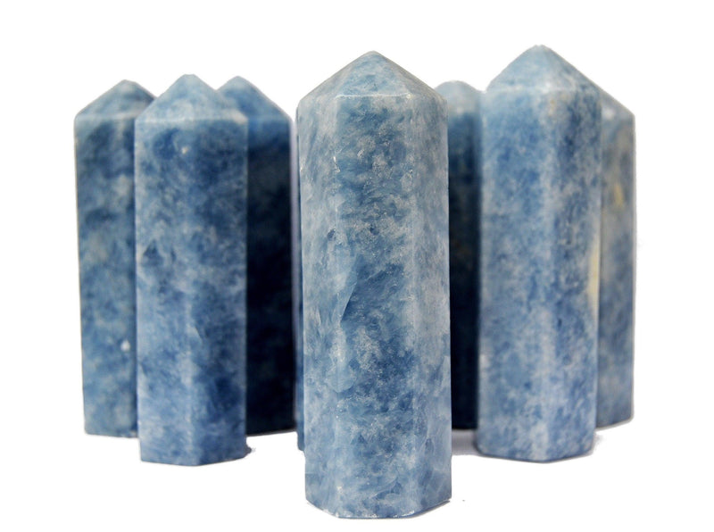 Some blue calcite crystal obelisks 110mm on white background