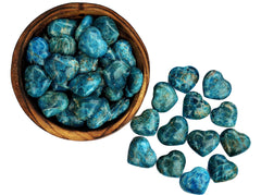 Several blue apatite crystal hearts 30mm inside a bowl and some hearts outside