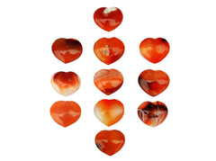 Several carnelian crystal hearts 30mm on white background
