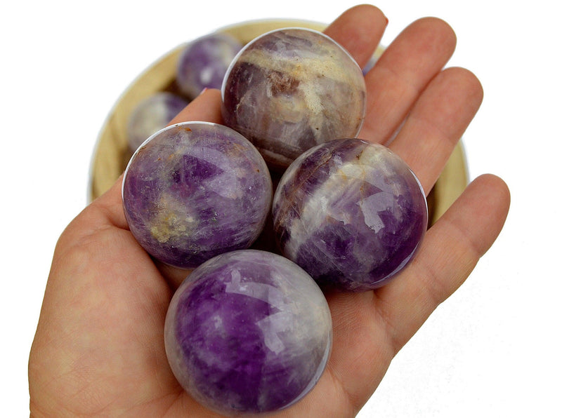 Four amethyst spheres 55mm on hand
