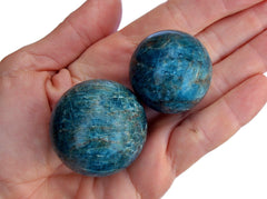 Two blue apatite mineral spheres 30mm-40mm on hand 