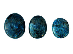 Three blue apatite palm stones 70mm-40mm on white background