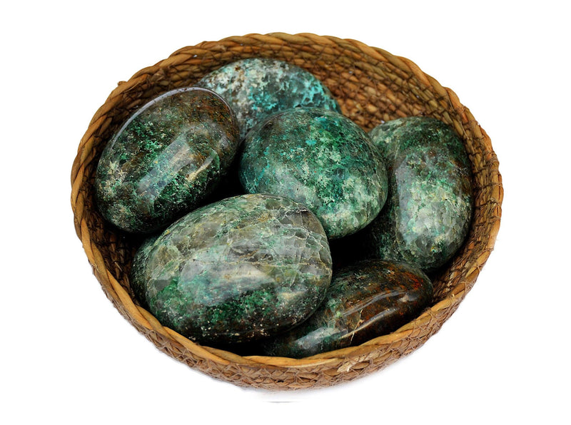 Some chrysocolla palm stones inside a basket