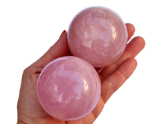 Two large rose quartz sphere crystals 55mm on hand