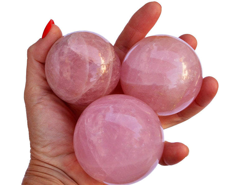 Three large rose quartz sphere crystals 55mm - 60mm on hand