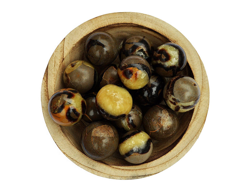 Several yellow septarian crystal spheres 25mm - 40mm inside a wood bowl